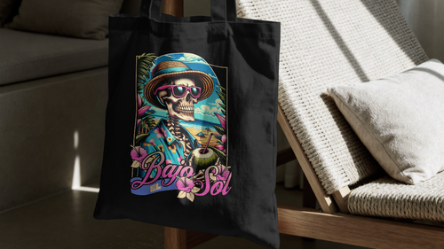 Black tote bag with colorful design on a chair in a room